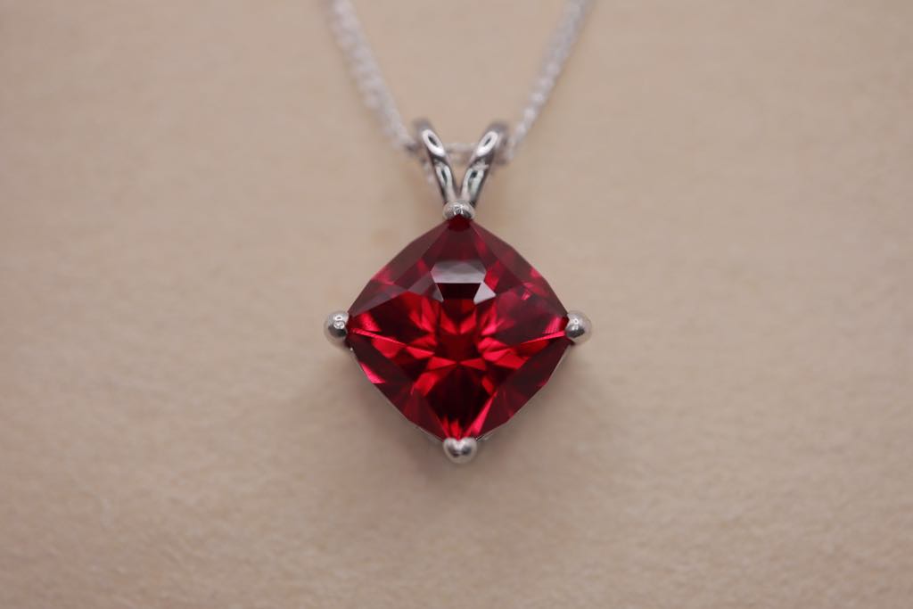 Necklace with a synthetic ruby