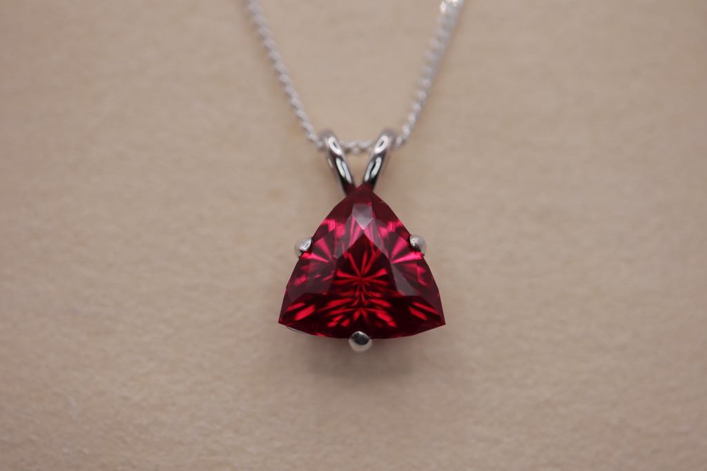 Necklace with a synthetic ruby