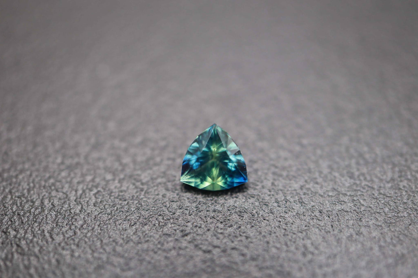 14k gold pendant with a sapphire setting