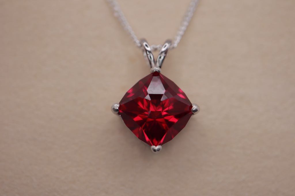 Necklace with a synthetic ruby