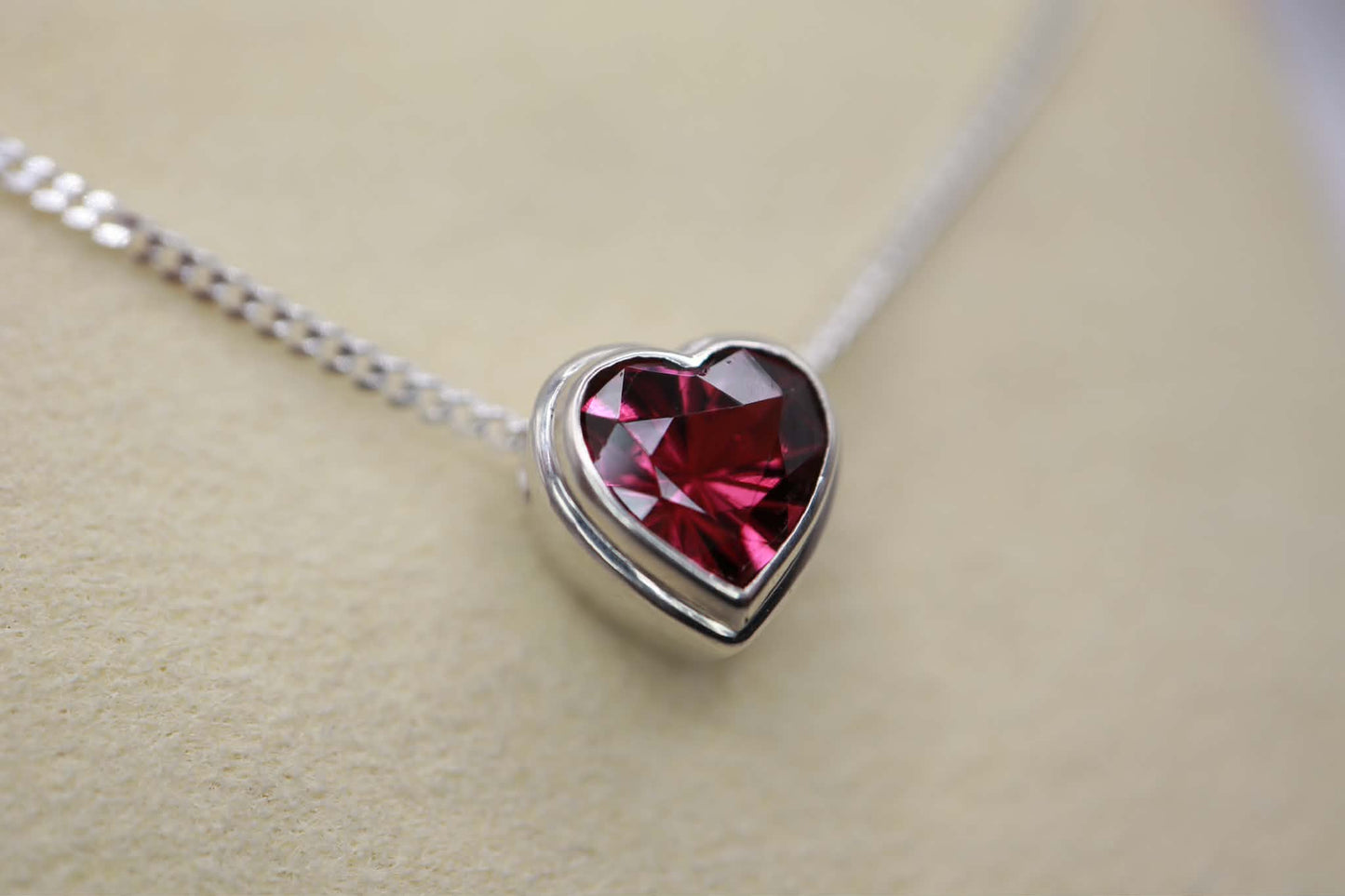 Sterling silver necklace with heart-shaped garnet