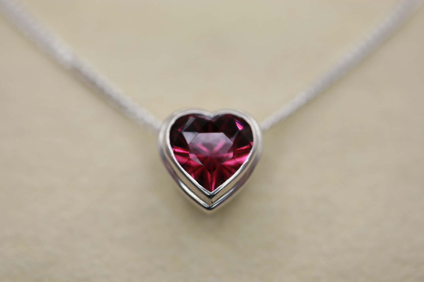 Sterling silver necklace with heart-shaped garnet